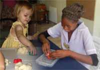 Idah Phiri and child with playdough